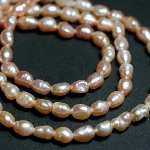 Fil 34cm 60pc environ - perles naturelles culture eau douce riz olives ovales 5-6mm rose orange saumon irisé